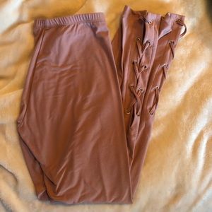 Dusty pink leggings with lace up detailing on side